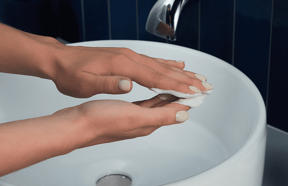 woman with shampoo on hands