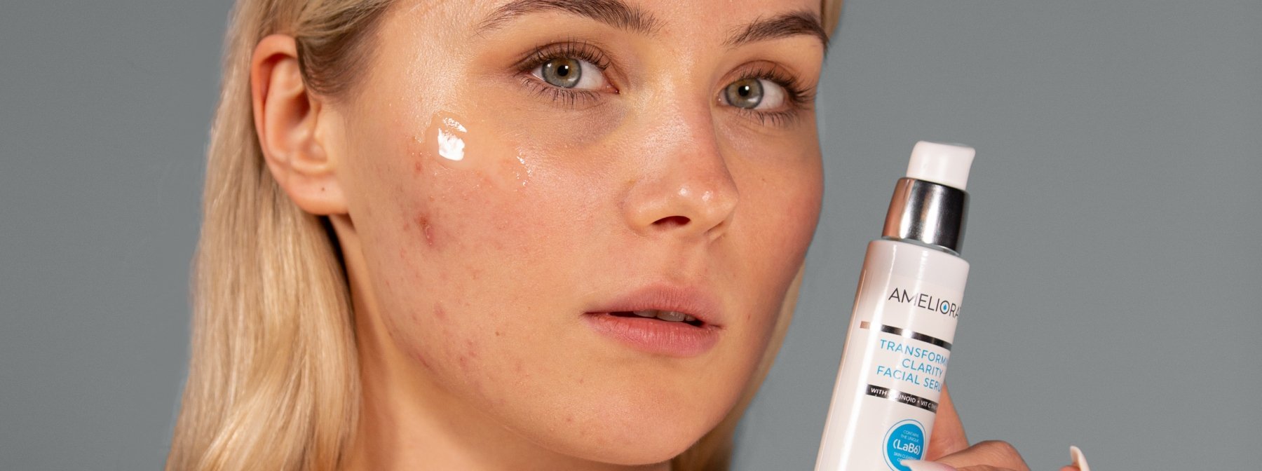 woman applying serum onto acne scars