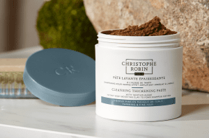 Christophe Robin's cleansing thickening paste, formulated for men with fine or thinning hair. A white bottle with blue accents.