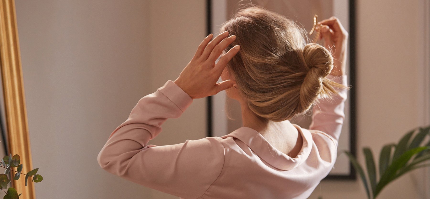 woman taking down hair before bed