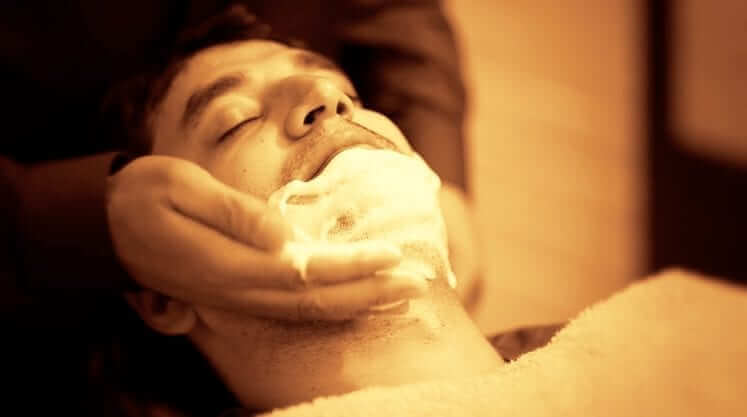 man enjoying a shave