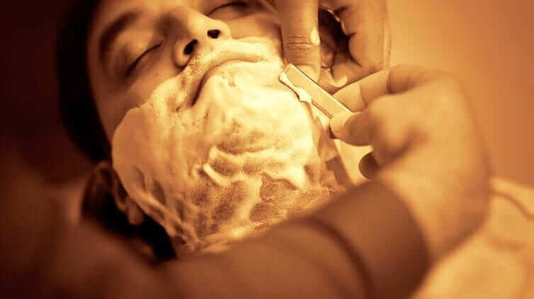 man enjoying a shave close up