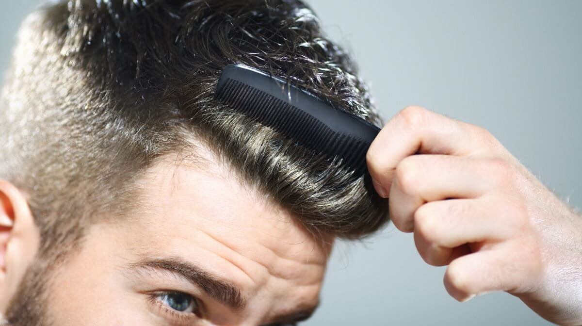 man preparing to cut his own hair at home