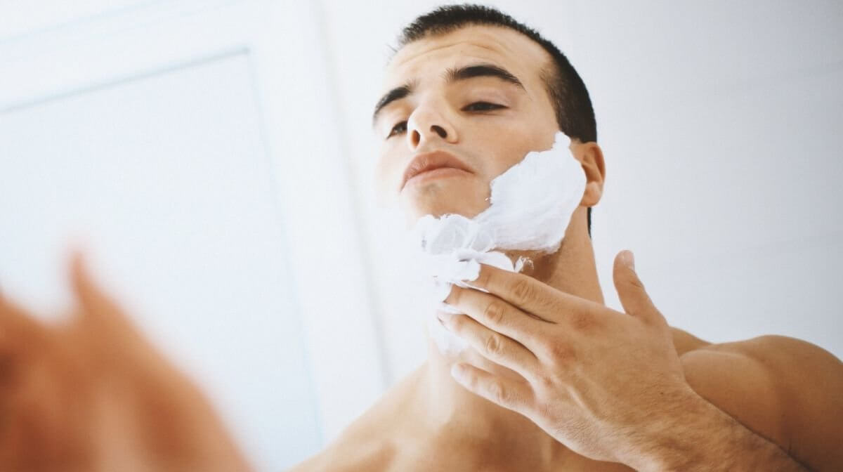 man applying Gillette shaving cream