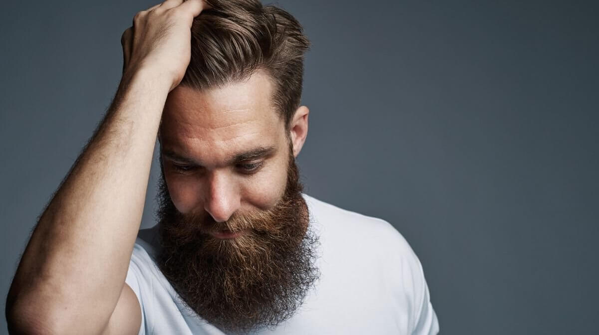 Man with groomed hipster long beard style 