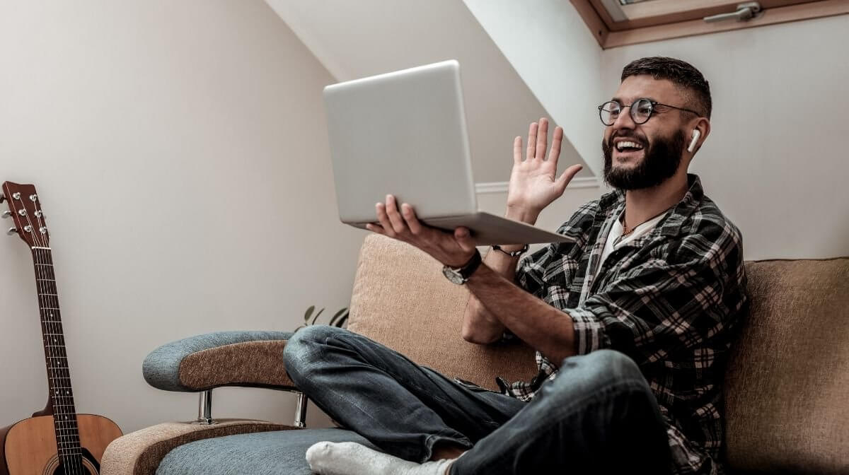 man speaking to loved ones via video call 