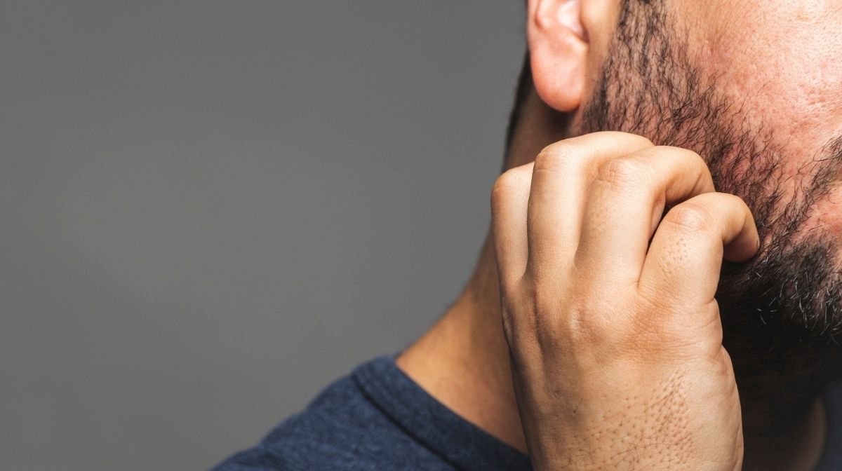 man with itchy beard dandruff