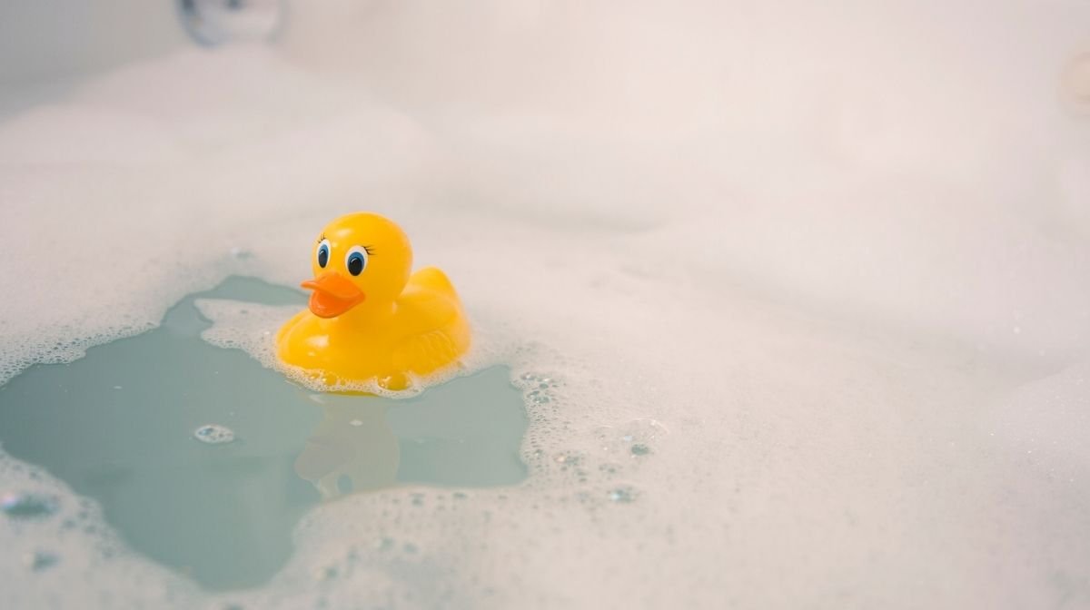 rubber duck floating in the bath