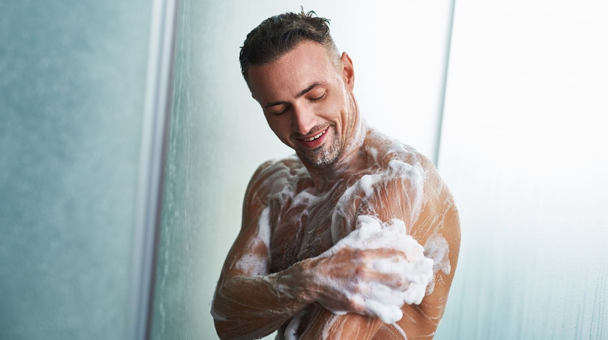 A man lathers up with shaving gel for an easier manscaping shave | Gillette UK