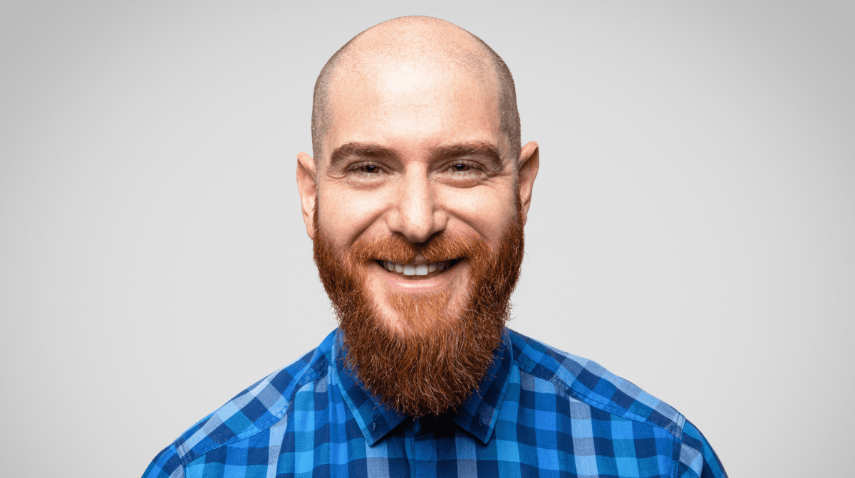 Man with bald head and ginger beard smiling