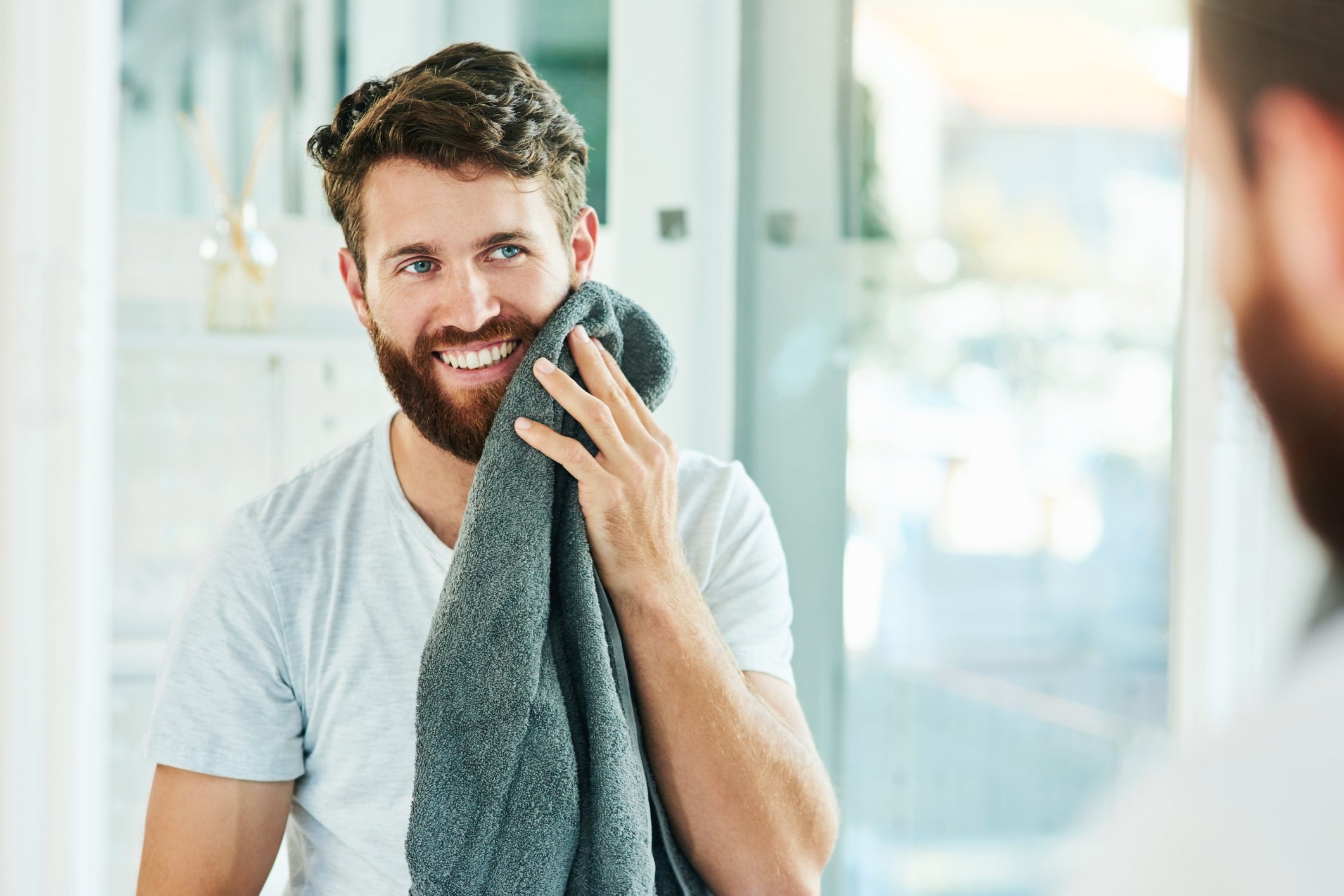 Man with a beard contemplates caring for it with the Gillette King C. range