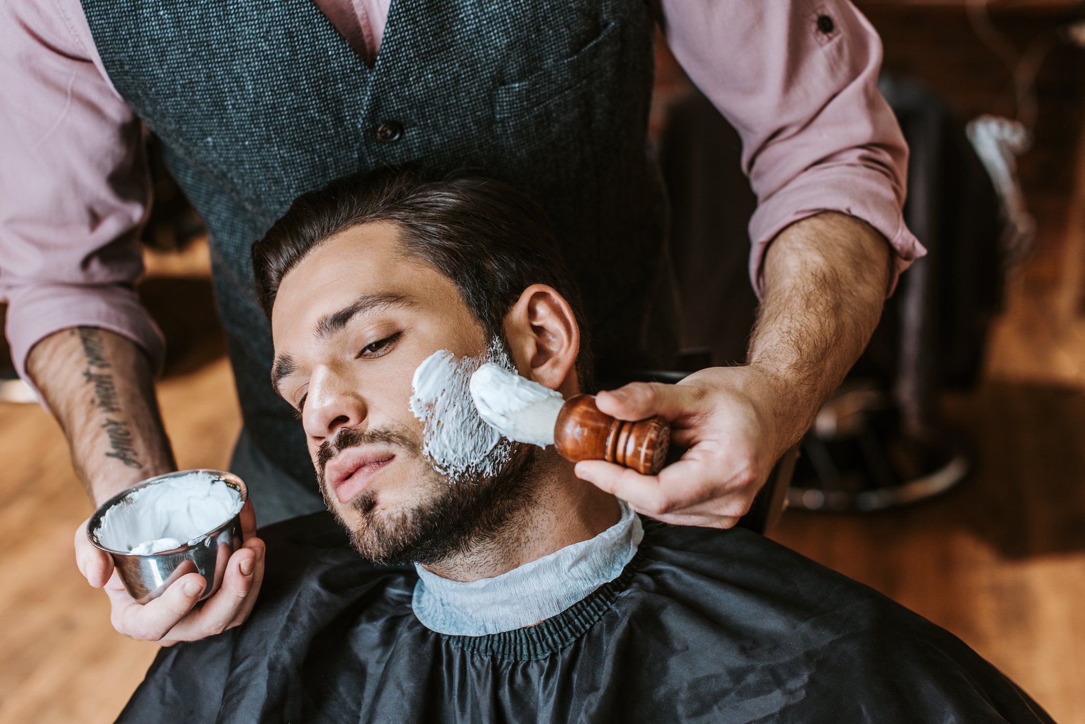 Shaving took place in a barbershop prior to King C. Gillette inventing the double-edged safety razor | Gillette UK