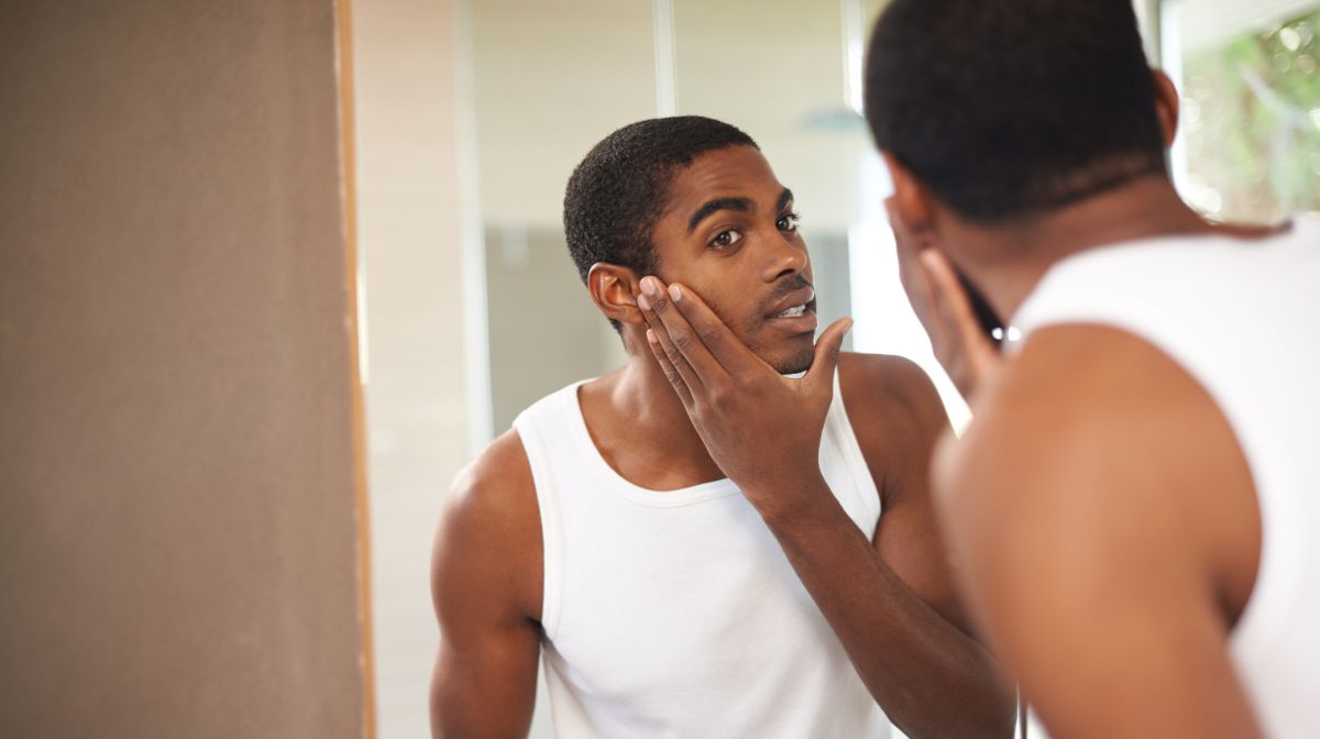 Man applies a scrub to exfoliate his skin prior to shaving | Gillette UK