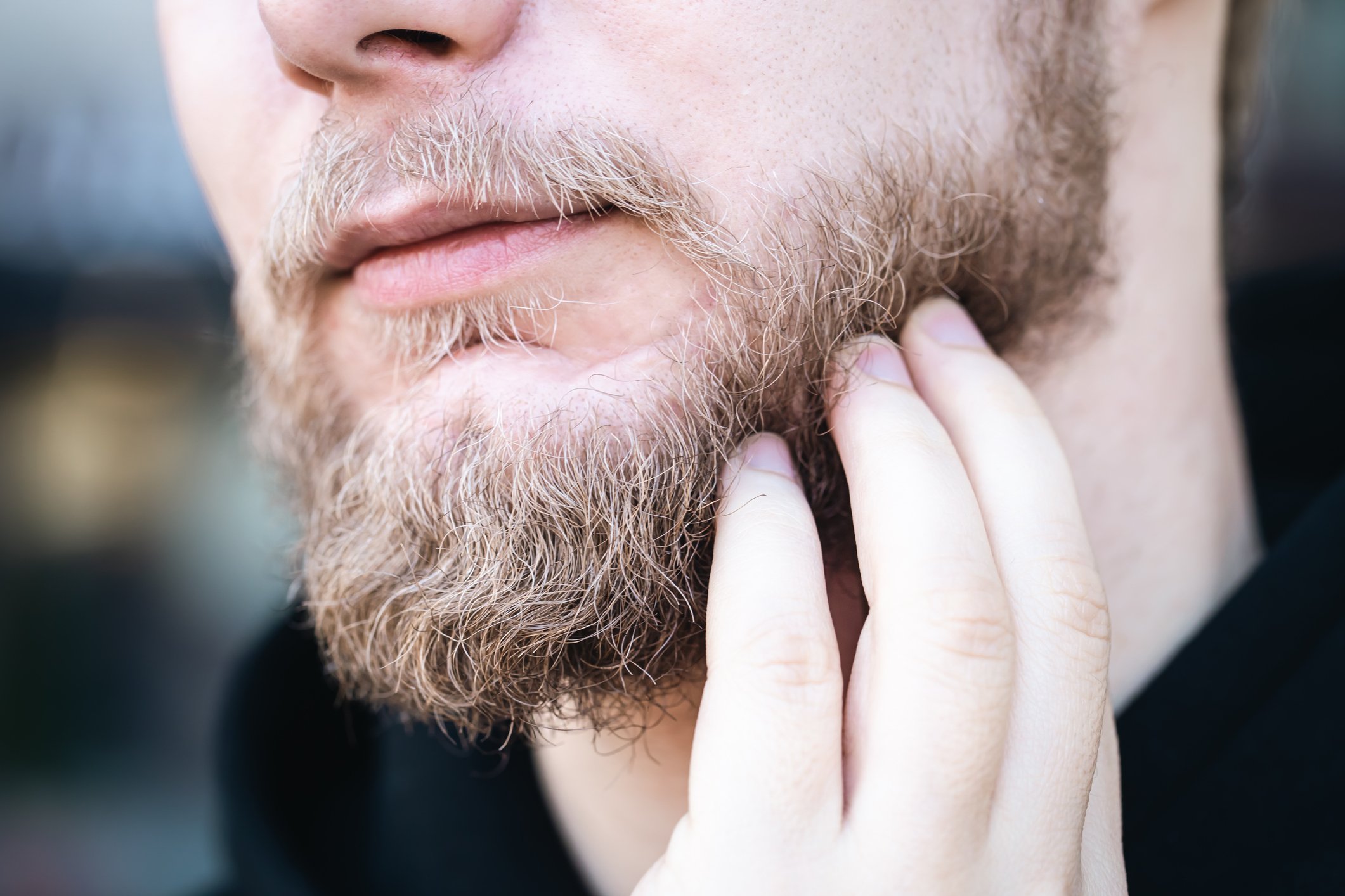 A man touches his patchy beard | Gillette UK
