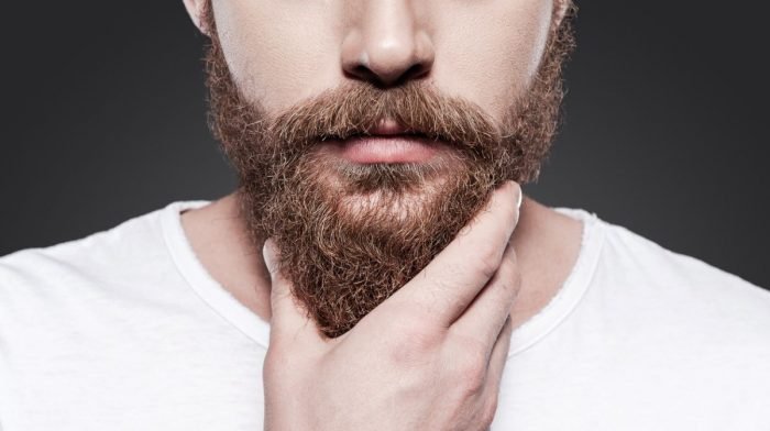 Man touching his stylish beard , styled using Gillette Proglide Styler Beard Trimmer