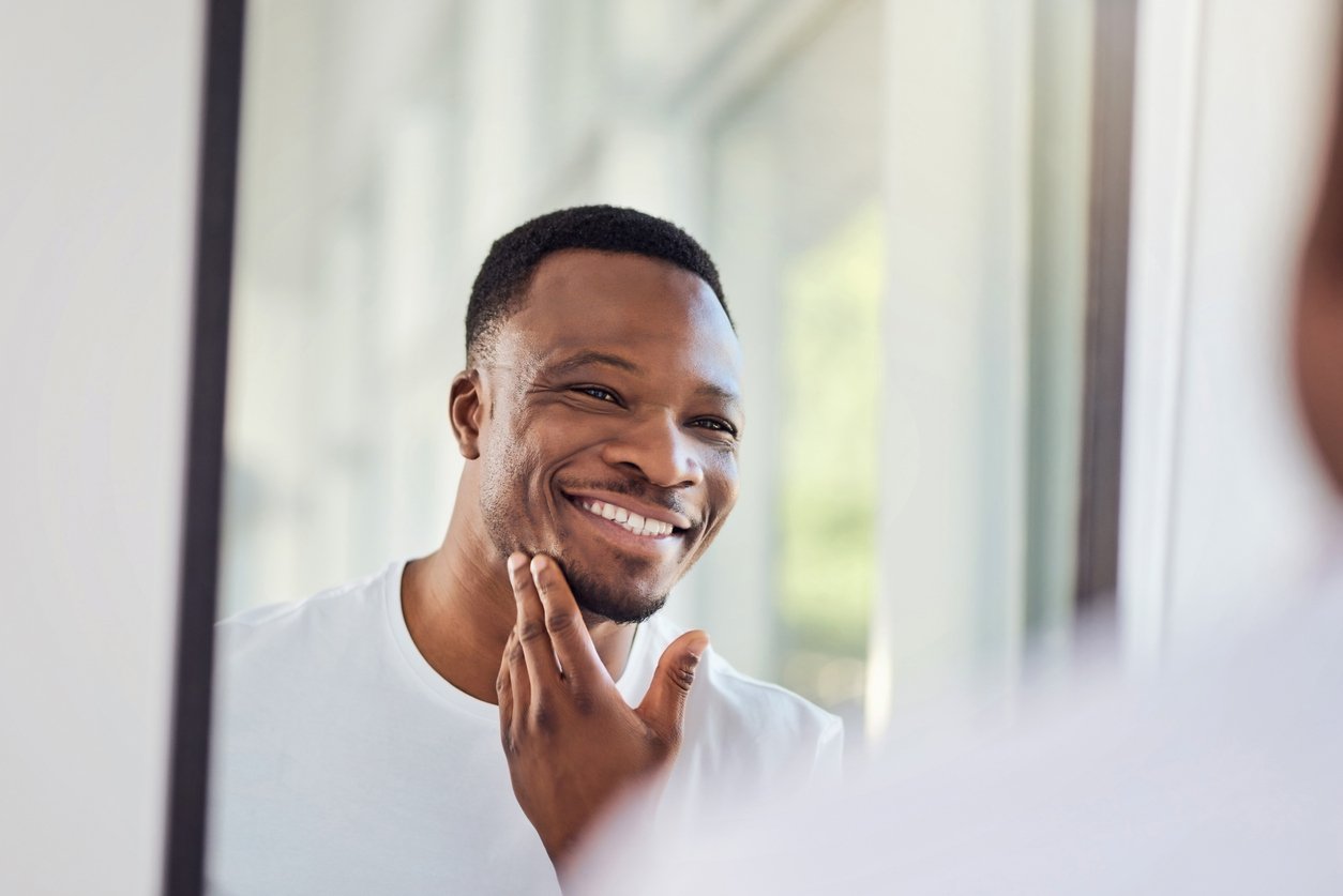 Man examining his face in the mirror after shaving using Gillette Fusion5 Razor | Gillette UK