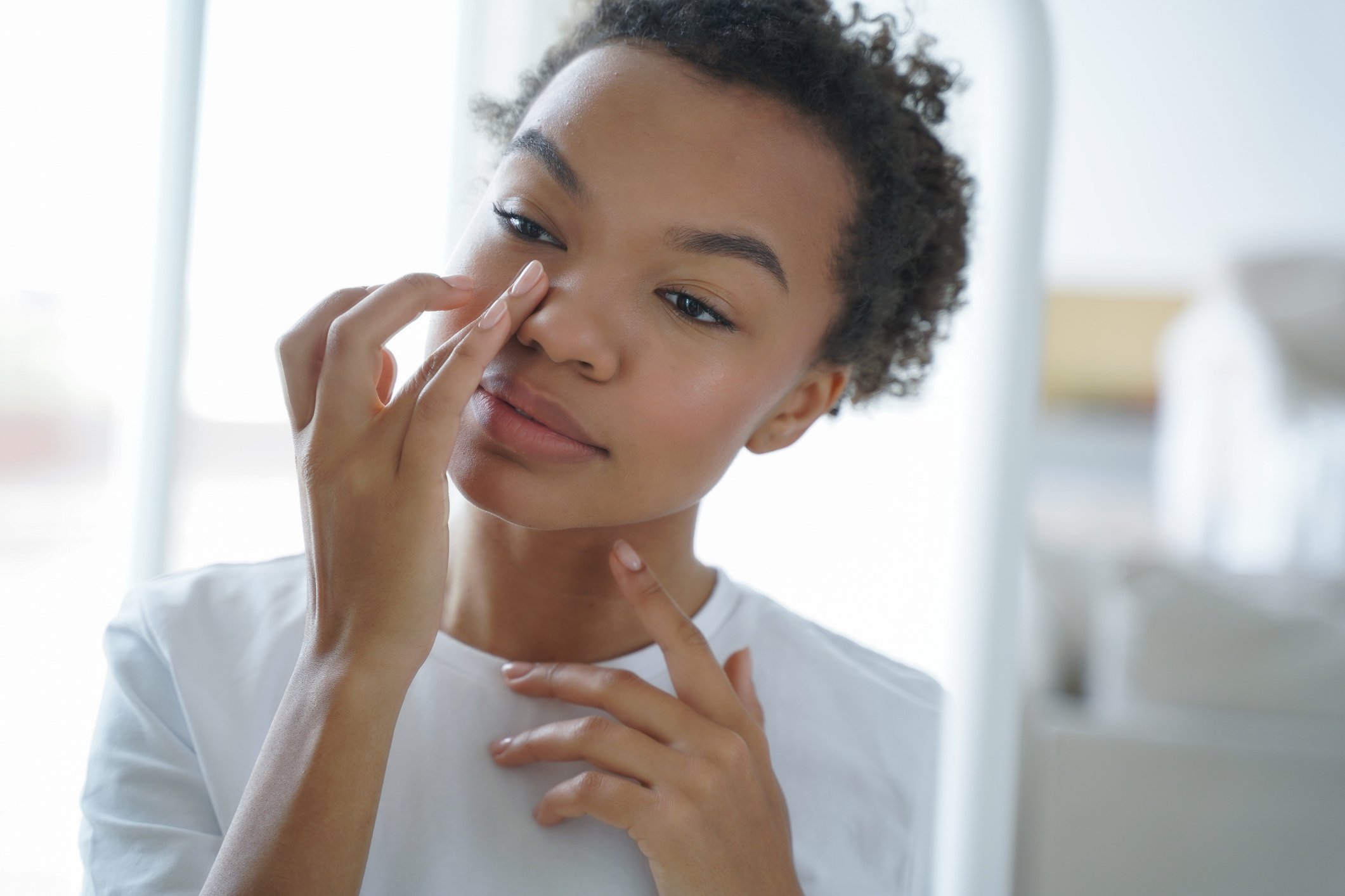 Woman applying Dermaplaning Cleansing Primer to her face | Venus UK