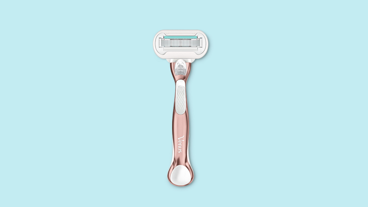 A rose gold Venus razor against a pale blue background | Venus UK