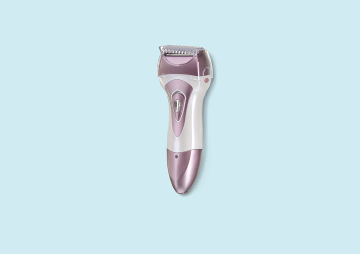An electric razor against a pale blue background | Venus UK