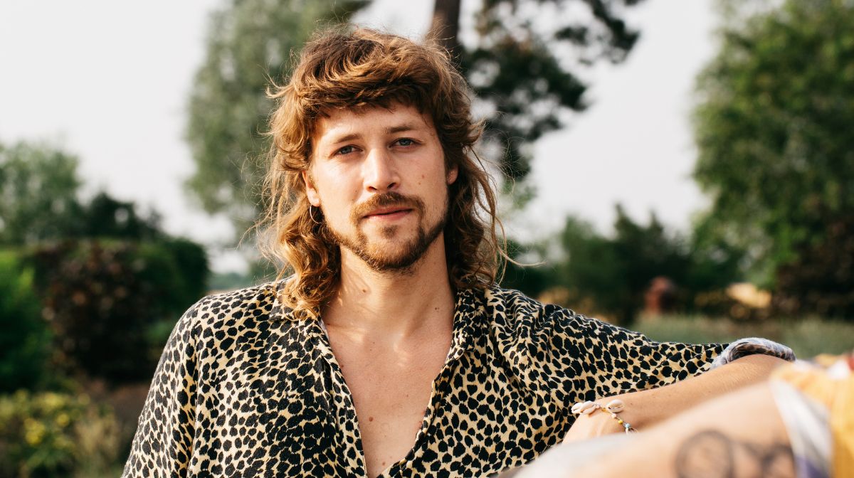 A Man in a leopard print shirt sports a modern short mullet | Gillette UK