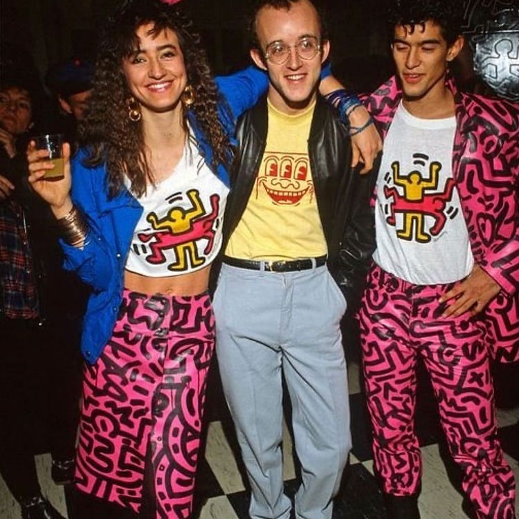 Keith Haring and people wearing his artwork 