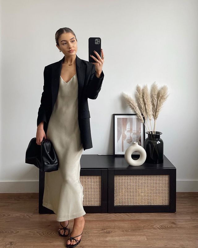 Women taking a mirror selfie in strappy sandals 