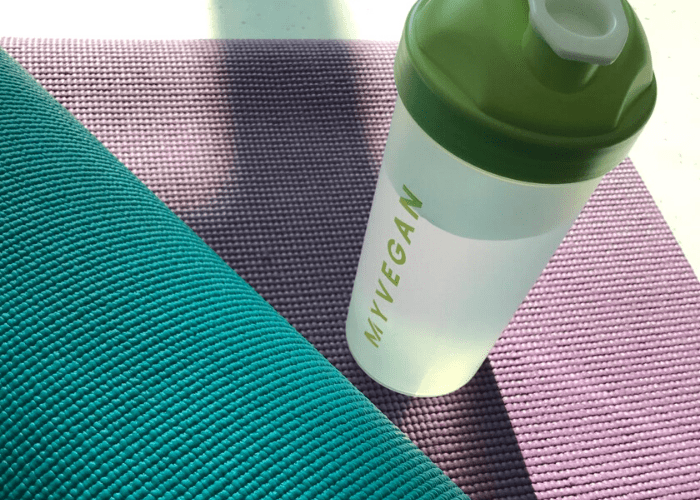 Myvegan shaker on yoga mat