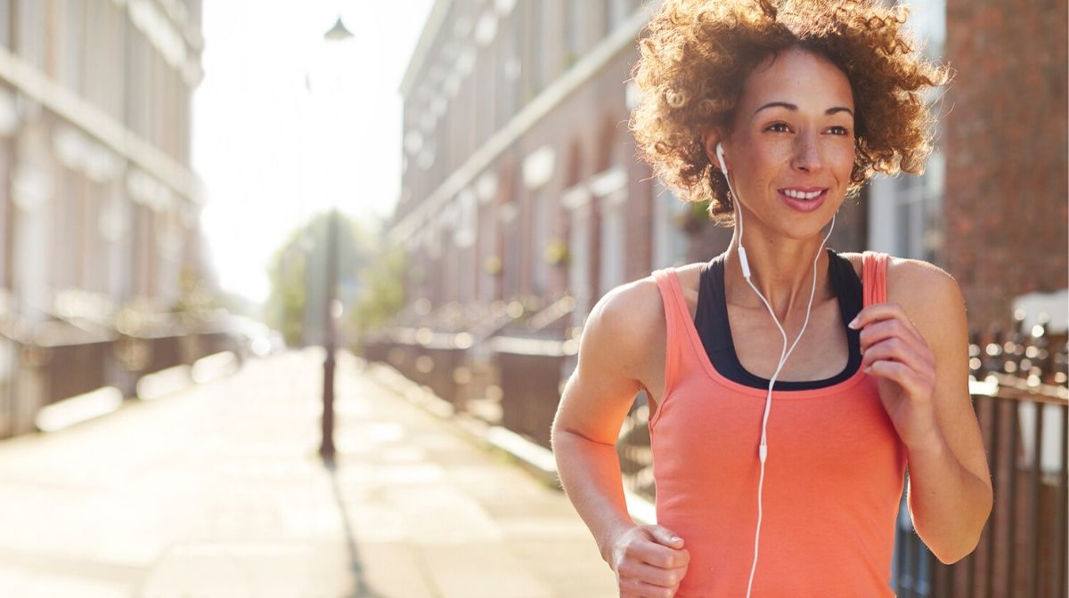 woman running down a quiet street