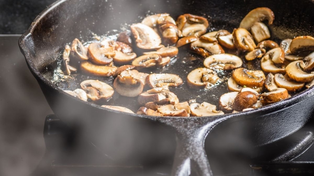 mushrooms frying in a pan