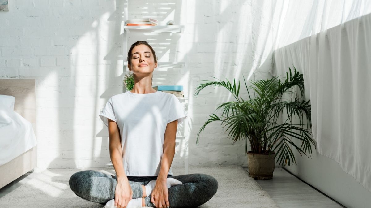 woman doing yoga at home