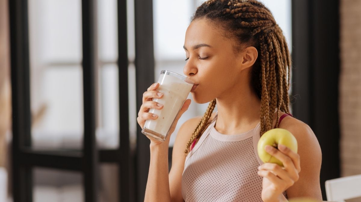 woman drinking glass of milk