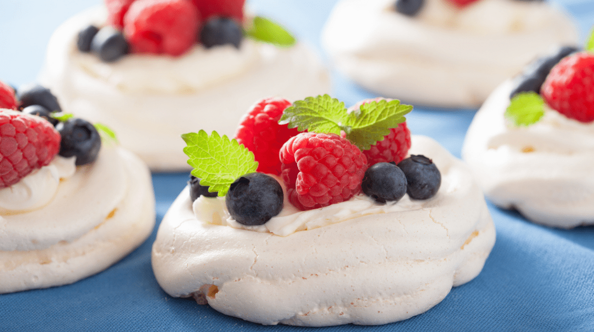 vegan meringue nest with blueberries and raspberries