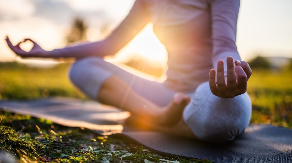 woman meditating outdoors