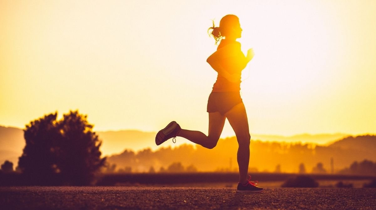 woman running at sunset