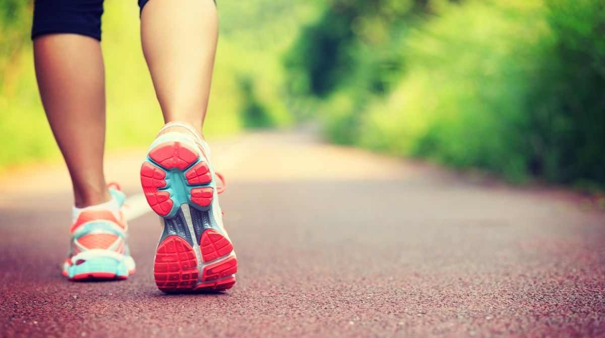 close-up of woman's feet in trainers walking outdoors