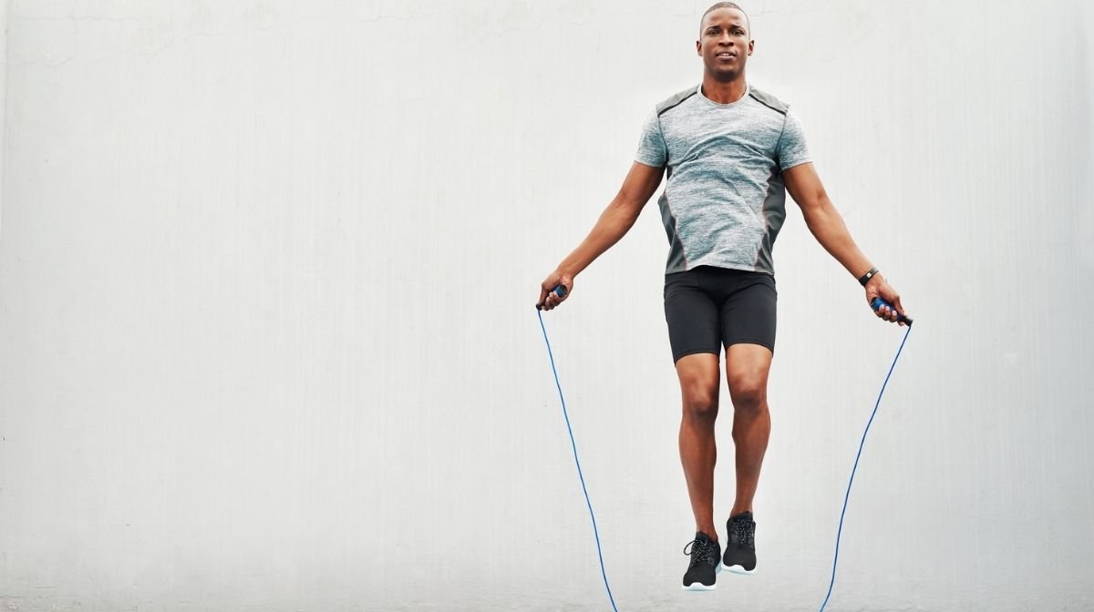 man working out with skipping rope