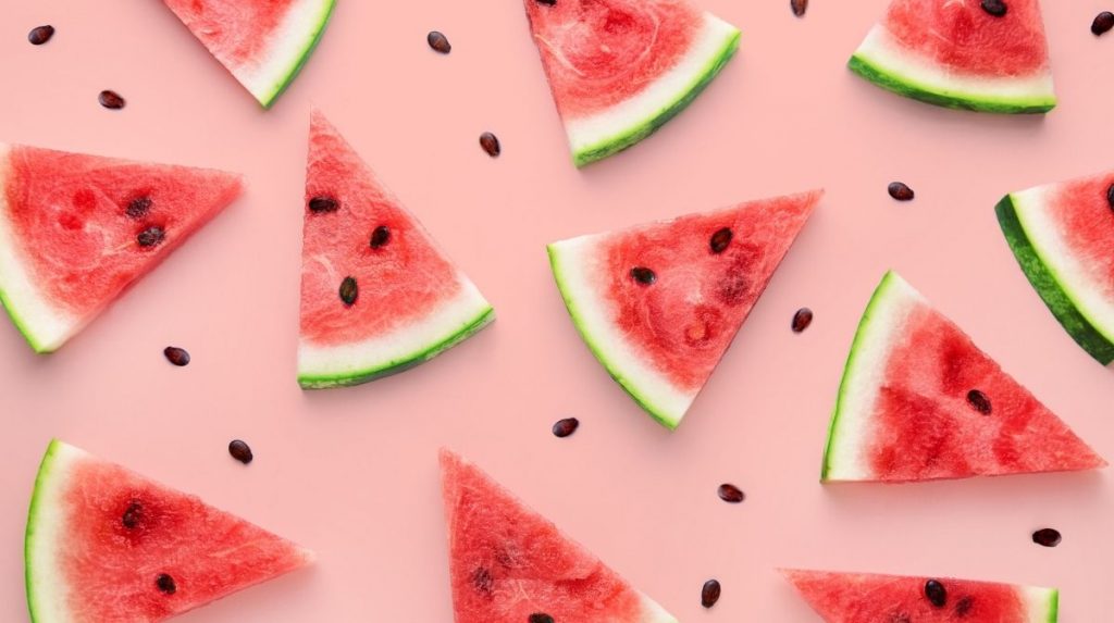 watermelon slices on a pink background.