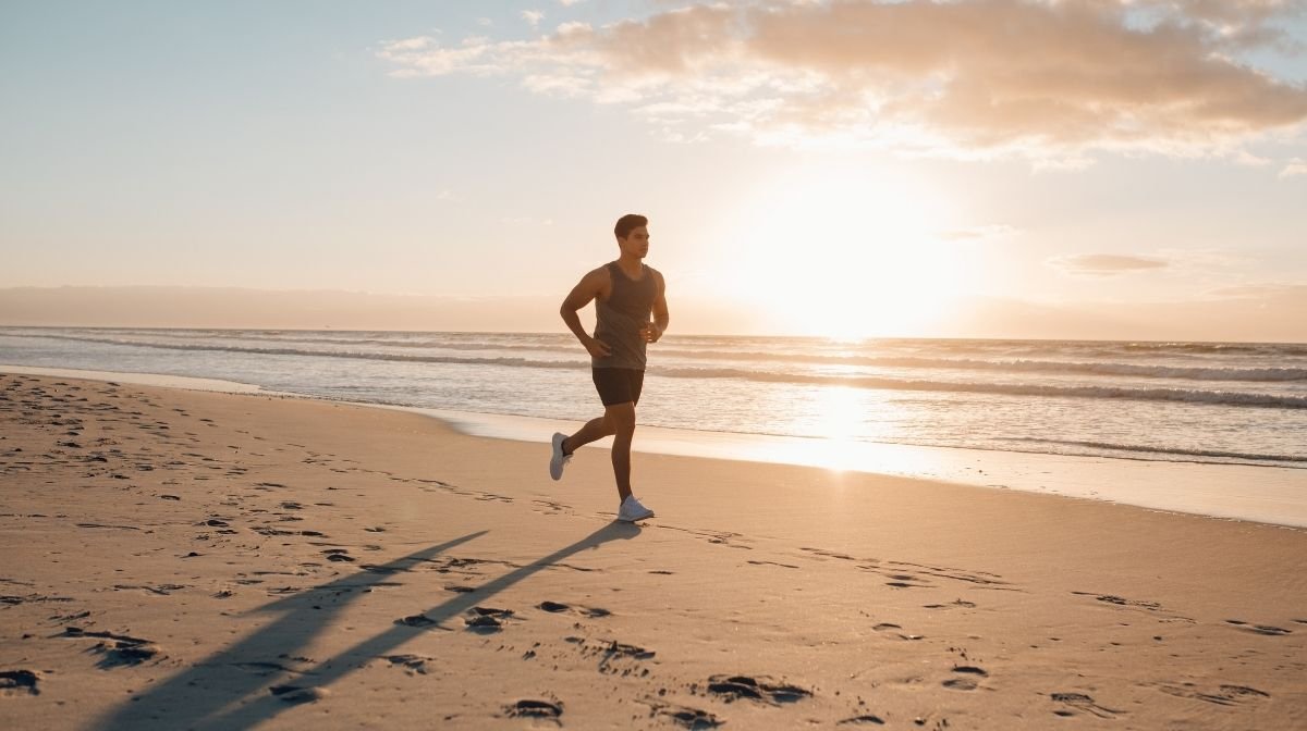 man running along the beach