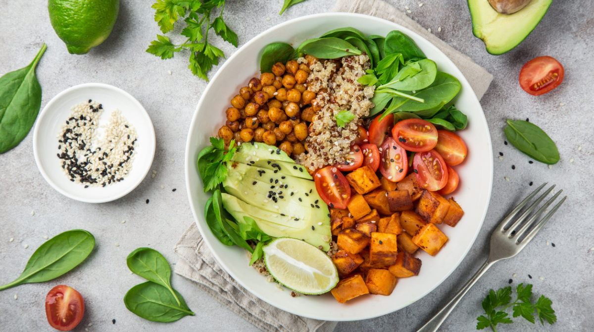 vegan high-protein bowl with quinoa, chickpeas, avocado, sweet potato and salad