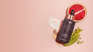 Intense Thickening Spray on a flat lay of ingredients