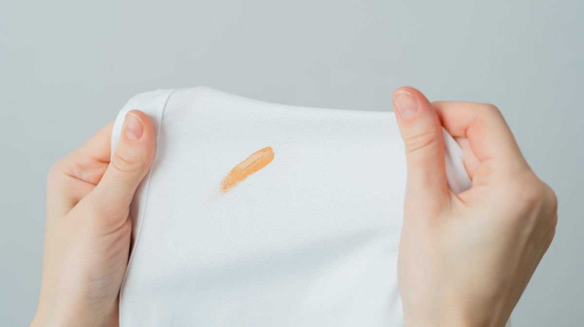 A foundation stain on white clothing.