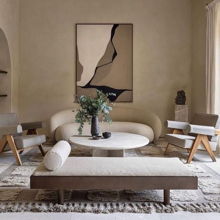 Neutral living room with wall art and a plant
