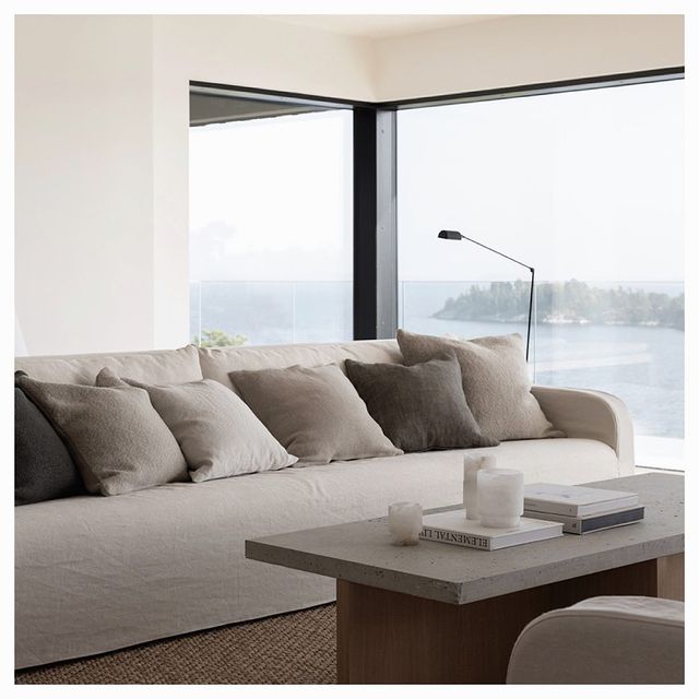 Sofa and coffee table infront of a big window 