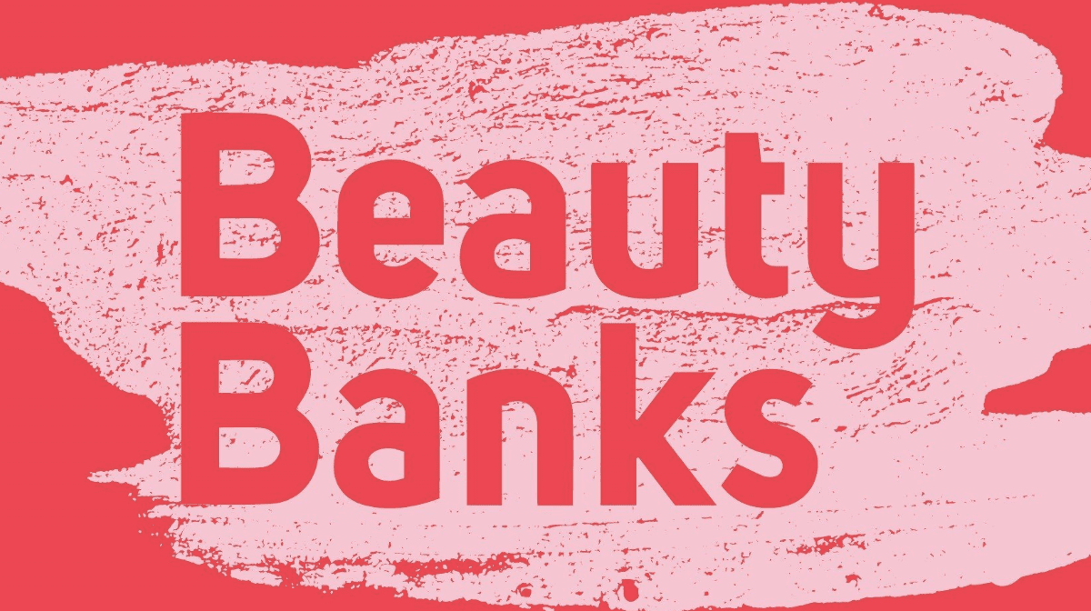 The Beauty Banks logo on a red and pink background