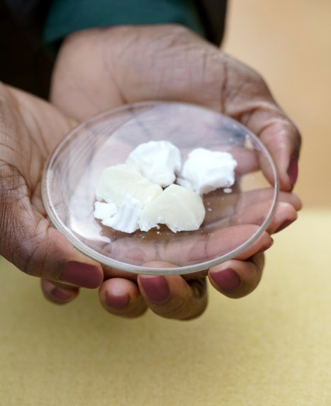 Abena Antwi holding shea butter in her hands 