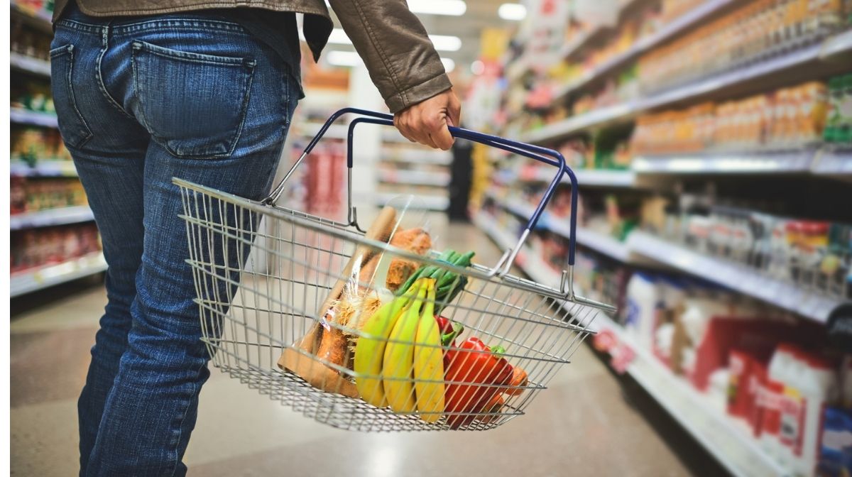 woman carrying a healthy shopping basket