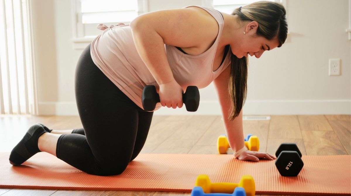 woman exercising at home