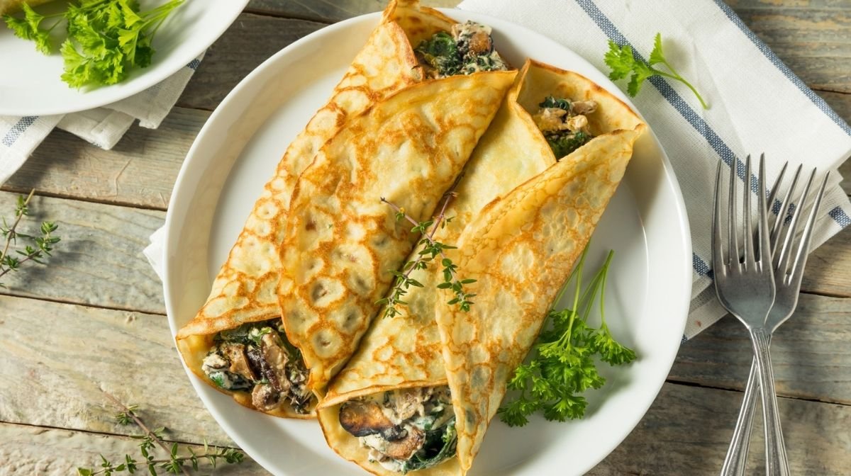 savoury crepes with cheese, spinach and mushrooms