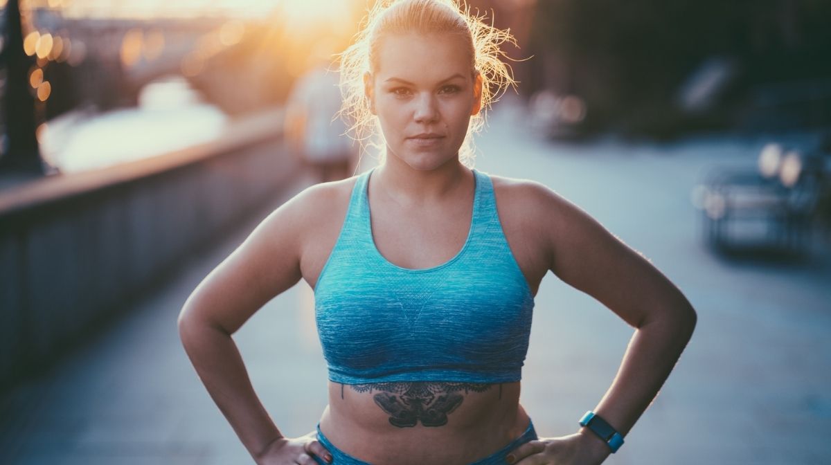 woman in workout gear looking determined