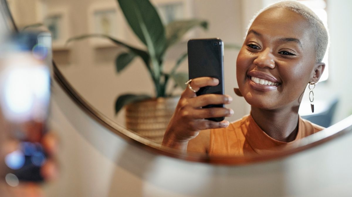 woman taking mirror selfie